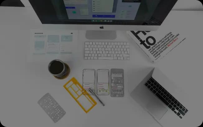 Clean, organized desk featuring design prototypes, reflecting a tidy workspace with focus on project planning.